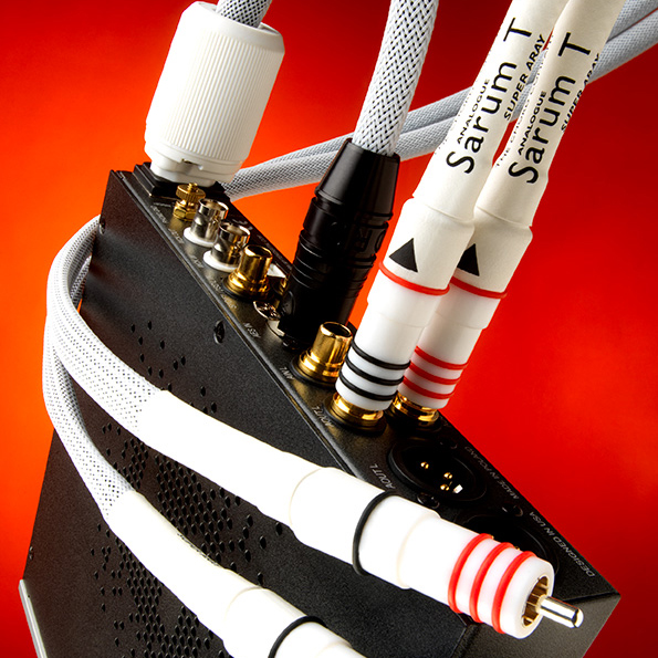 An image depicting Chord Sarum T cables being plugged into a HiFi product.