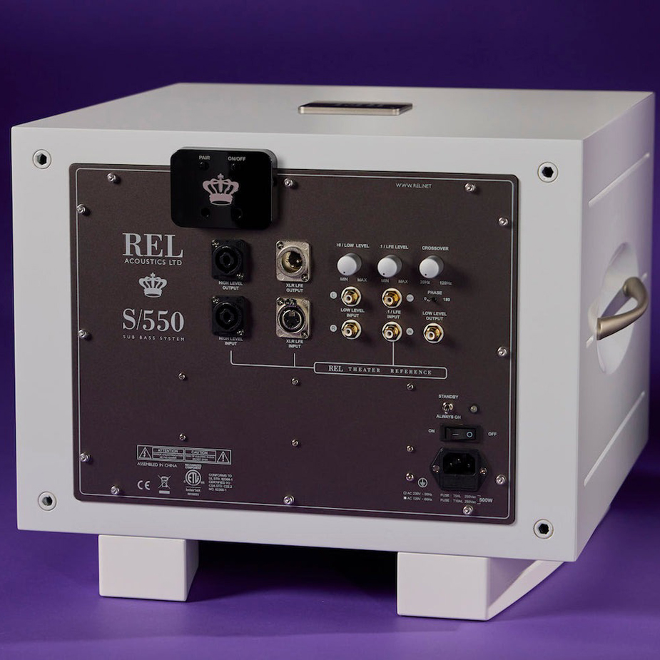 Product image of a REL AirShip Direct Subwoofer Wireless Transmitter on the back of a REL S/550 Subwoofer in White Gloss.
