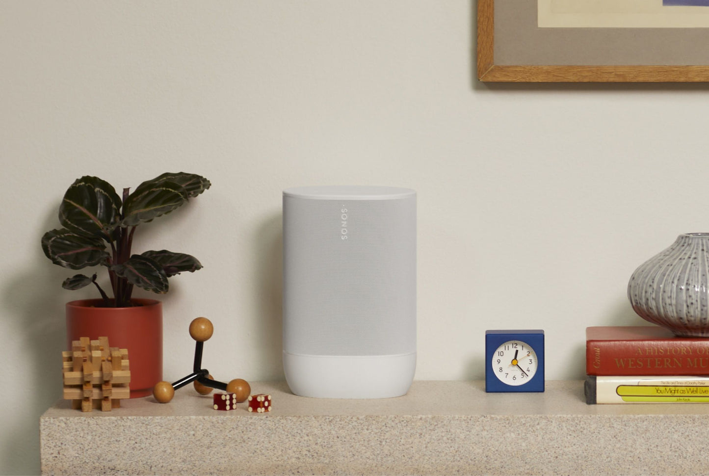 Lifestyle Image of a Sonos Move 2 portable speaker in white.